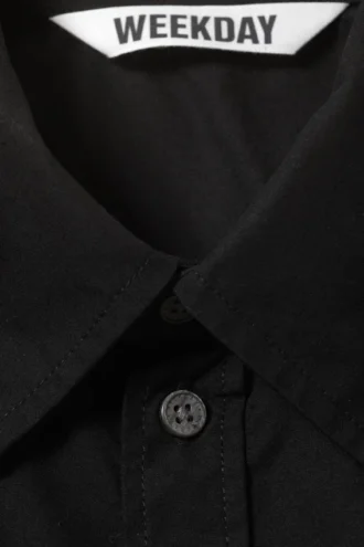 Kastenförmiges Baumwollhemd mit kurzen Shorts – Schwarz Kastenförmiges Baumwollhemd mit kurzen Shorts – Schwarz