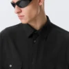 Kastenförmiges Baumwollhemd mit kurzen Shorts – Schwarz Kastenförmiges Baumwollhemd mit kurzen Shorts – Schwarz