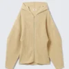 Langer Strick-Kapuzenpullover mit Reißverschluss – Beige Langer Strick-Kapuzenpullover mit Reißverschluss – Beige