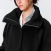 Locker sitzende Wolljacke mit Raglanärmeln – Schwarz Locker sitzende Wolljacke mit Raglanärmeln – Schwarz
