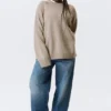 Locker sitzender Strickpullover aus Wolle – Hellbraun meliert