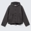 Lockere Canvas-Jacke mit Kapuze – Schwarz meliert Lockere Canvas-Jacke mit Kapuze – Schwarz meliert