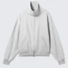 Lockere Strickjacke mit Trichterkragen und Reißverschluss – Grau meliert Lockere Strickjacke mit Trichterkragen und Reißverschluss – Grau meliert