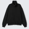 Lockere Strickjacke mit Trichterkragen und Reißverschluss – Schwarz Lockere Strickjacke mit Trichterkragen und Reißverschluss – Schwarz