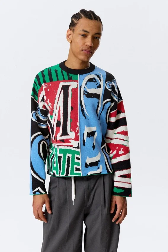 Lockerer, grafisch mit Print bedruckter Baumwoll-Pullover – mehrfarbiger Print Lockerer, grafisch mit Print bedruckter Baumwoll-Pullover – mehrfarbiger Print