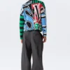 Lockerer, grafisch mit Print bedruckter Baumwoll-Pullover – mehrfarbiger Print Lockerer, grafisch mit Print bedruckter Baumwoll-Pullover – mehrfarbiger Print