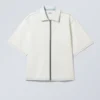 Lockeres, kurzärmeliges Denim-Shirt mit Reißverschluss – Blotch Blue Lockeres, kurzärmeliges Denim-Shirt mit Reißverschluss – Blotch Blue