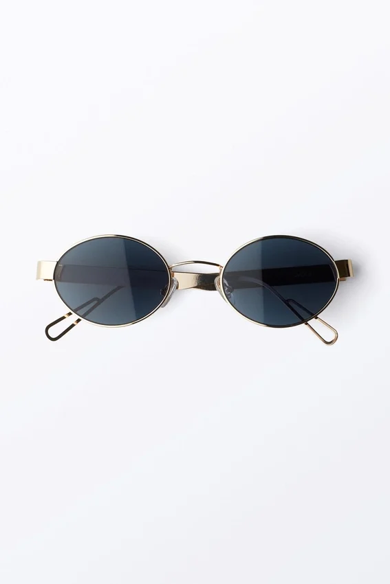 Minimalistische ovale Sonnenbrille aus Metall – Goldfarben – Dunkelblaue Gläser Minimalistische ovale Sonnenbrille aus Metall – Goldfarben – Dunkelblaue Gläser