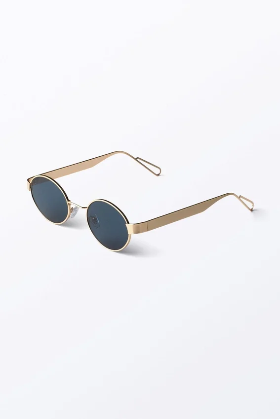Minimalistische ovale Sonnenbrille aus Metall – Goldfarben – Dunkelblaue Gläser Minimalistische ovale Sonnenbrille aus Metall – Goldfarben – Dunkelblaue Gläser