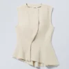 Ärmelloses, asymmetrisches Peplum-Top – Ecru Ärmelloses, asymmetrisches Peplum-Top – Ecru