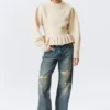 Strickpullover mit Volants am Saum – Off-White