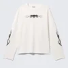Tolles, kastenförmiges Langarmshirt mit Print – Weiß – Totenkopf-Flamme Tolles, kastenförmiges Langarmshirt mit Print – Weiß – Totenkopf-Flamme