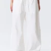 Weit geschnittene Hose mit niedriger Taille und Waschoptik – Weiß