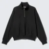 Weit geschnittenes Fleece-Sweatshirt mit halbem Reißverschluss – Schwarz Weit geschnittenes Fleece-Sweatshirt mit halbem Reißverschluss – Schwarz